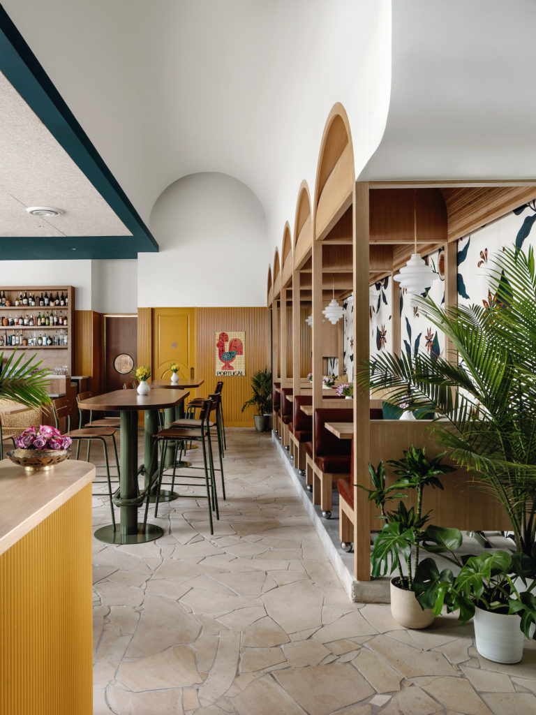 The de Gama Canteen dining space features fig wallpaper, flagstone flooring, white oak walls and millwork, and ornate textiles. (Photo by Chase Daniel)