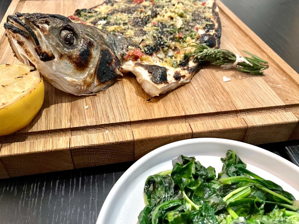 Branzino - broiled sea bass with wilted spinach is the house specialty at Il'Modo. Photo by Courtney Dabney. 