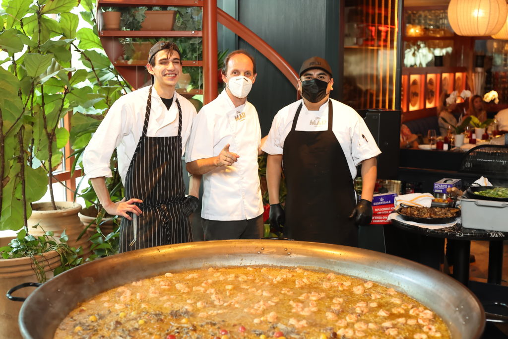MAD/BCN co-owner and executive chef Luis Roger and staff with the massive paella prepared for the Fabergé/Correa Family Foundation benefit luncheon at MAD. (Photo by Quy Tran)