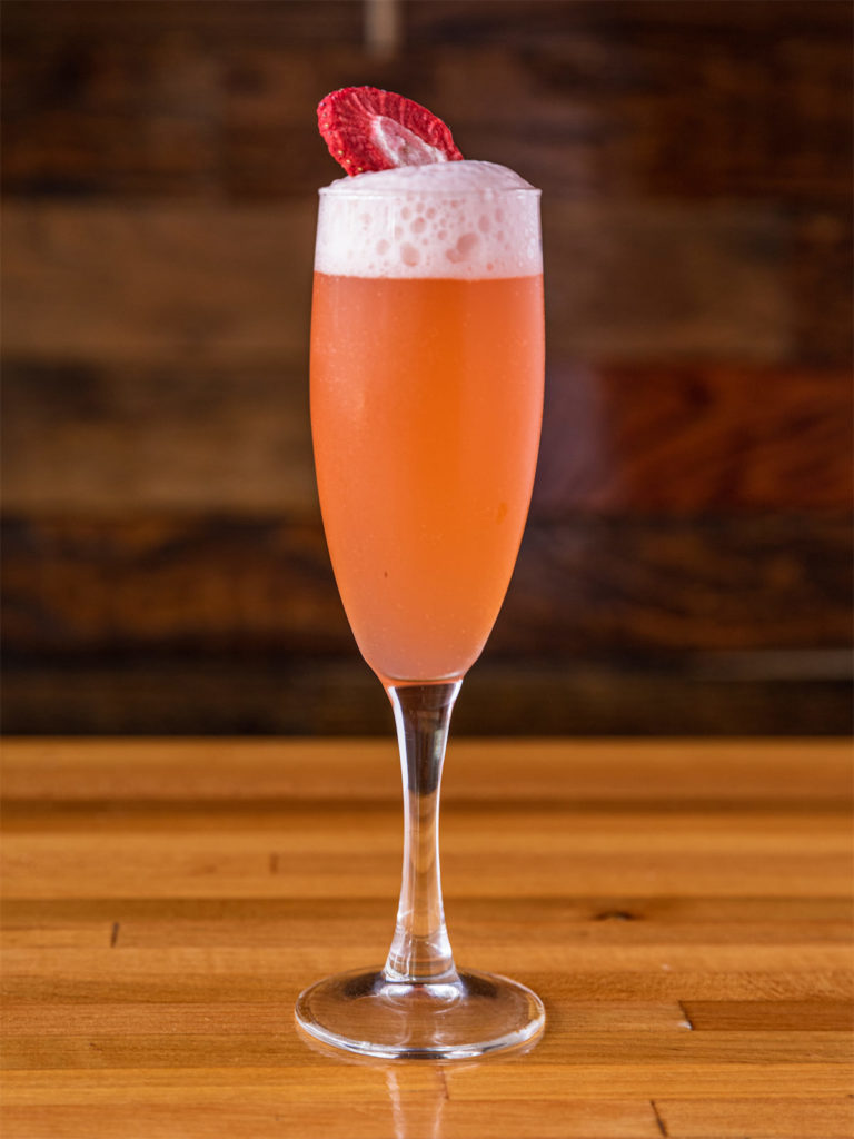 Pardon My French is a sweet concoction of strawberry-infused gin, tarragon, lemon, and bubbles. (Photo by Samantha Marie Photography)