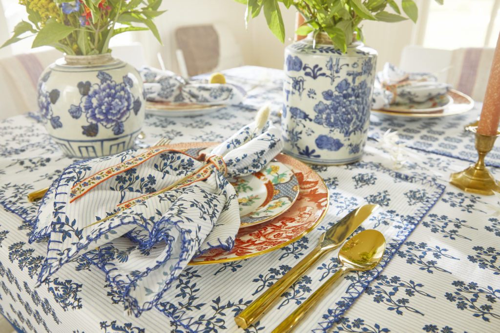 Hunter Bell's tablecloth, placemats and napkins in Western Willow Blue create a charming, inviting tablescape.
