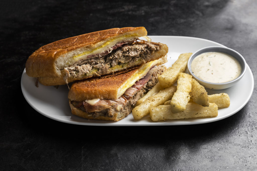 Tally's Cuban with mojo roasted pork, smoked ham, swiss, pickles, and yucca fritta. (Photo by Julie Soefer)