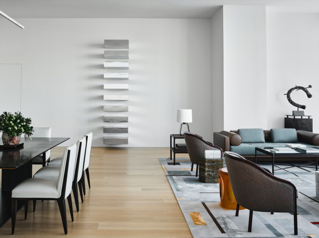 On the wall, an untitled stainless-steel sculpture by Donald Judd. (Photo by Douglas Friedman)