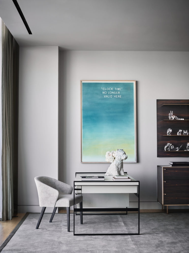 A sitting area in the main bedroom has a Magni desk and chair from The Bright Group. Dresser is KGBL. Jeff Koons' porcelain Puppy Vase. Edward Ruscha's "Clock Time" Not Longer Valid Here. (Photo by Douglas Friedman)
