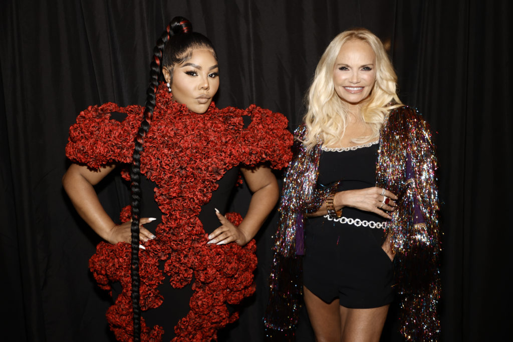 Lil' Kim, left, and Kristin Chenoweth were on the front row at the Christian Siriano runway show. (Photo by Jamie McCarthy/Getty Images for Christian Siriano)