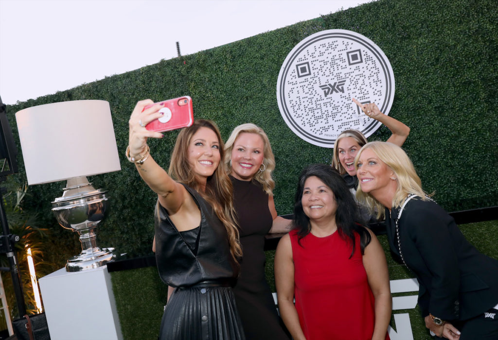Renee Parsons with Dallas guests and DJ Lucy Wrubel at the PXG Dallas grand opening in Plano, Texas.  (Photo by Rick Kern/Getty Images for PXG)