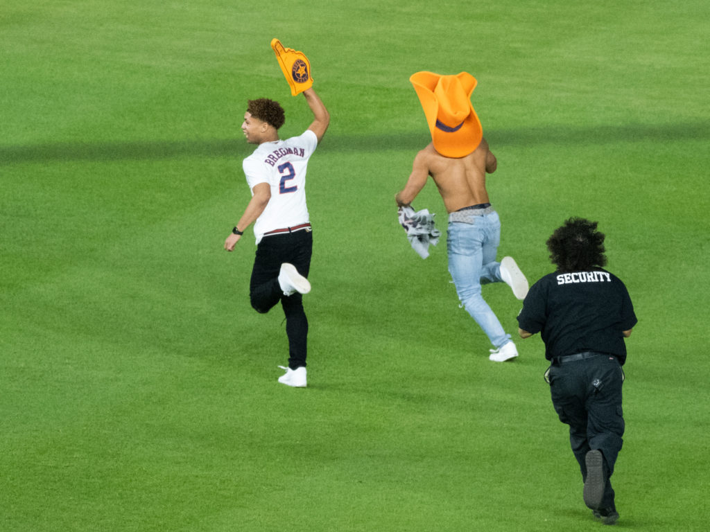 The Astros fans running on the field proved to be elusive. (Photo by F. Carter Smith)
