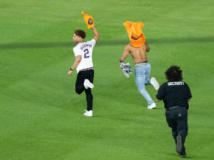 Astros fans run field security