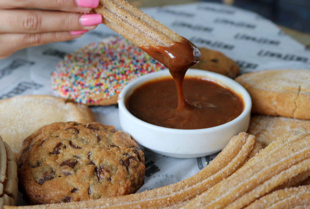 Fresh baked churros with dulce de leche dipping sauce. (Photo by Paula Murphy)