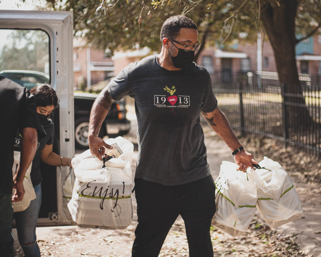 Chef Chris Williams delivering food from his community kitchen from which more than 300,000 meals were delivered since the pandemic to those in need of food.