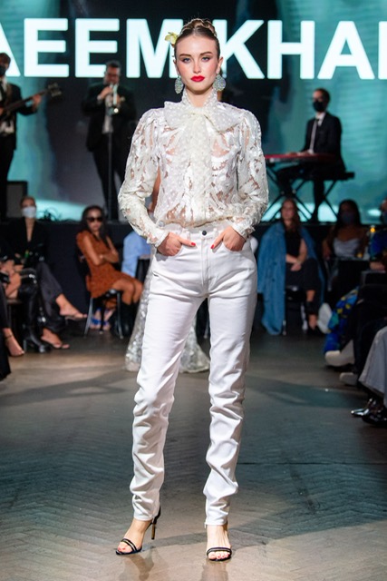 Naeem Khan ivory pleated ribbon blouse with point d'esprit detail and hemp jeans. (Photo courtesy of Naeem Khan)