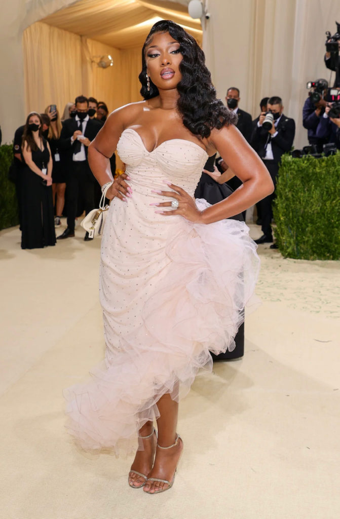Megan Thee Staillion wears a pale pink Coach gown with feathered hem. (Instagram: @metmuseum)