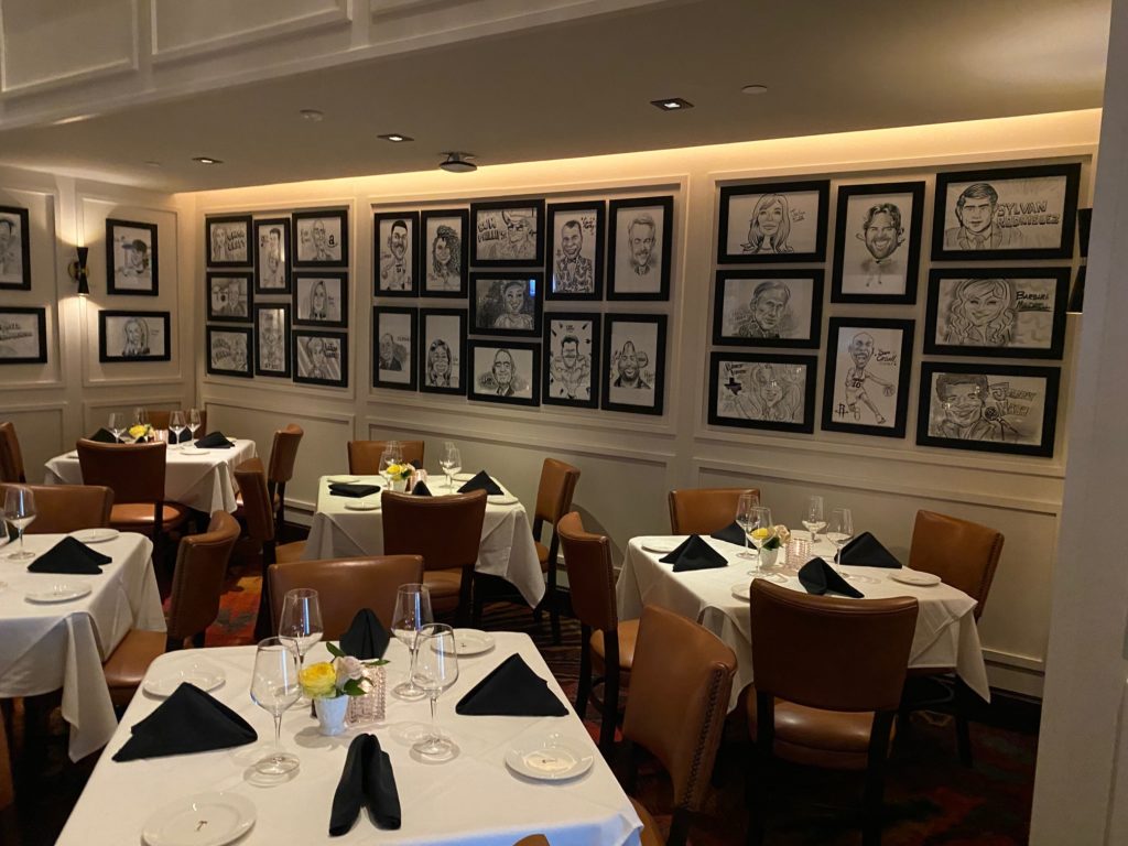 The murals and caricatures, staples of the Palm Restaurant decor throughout the country, are present in the new downtown steak house. (Photo by Shelby Hodge)