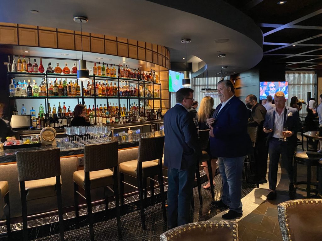 The bar in the new Palm Restaurant, located in downtown Houston, is sleek and sophisticated. (Photo by Shelby Hodge)