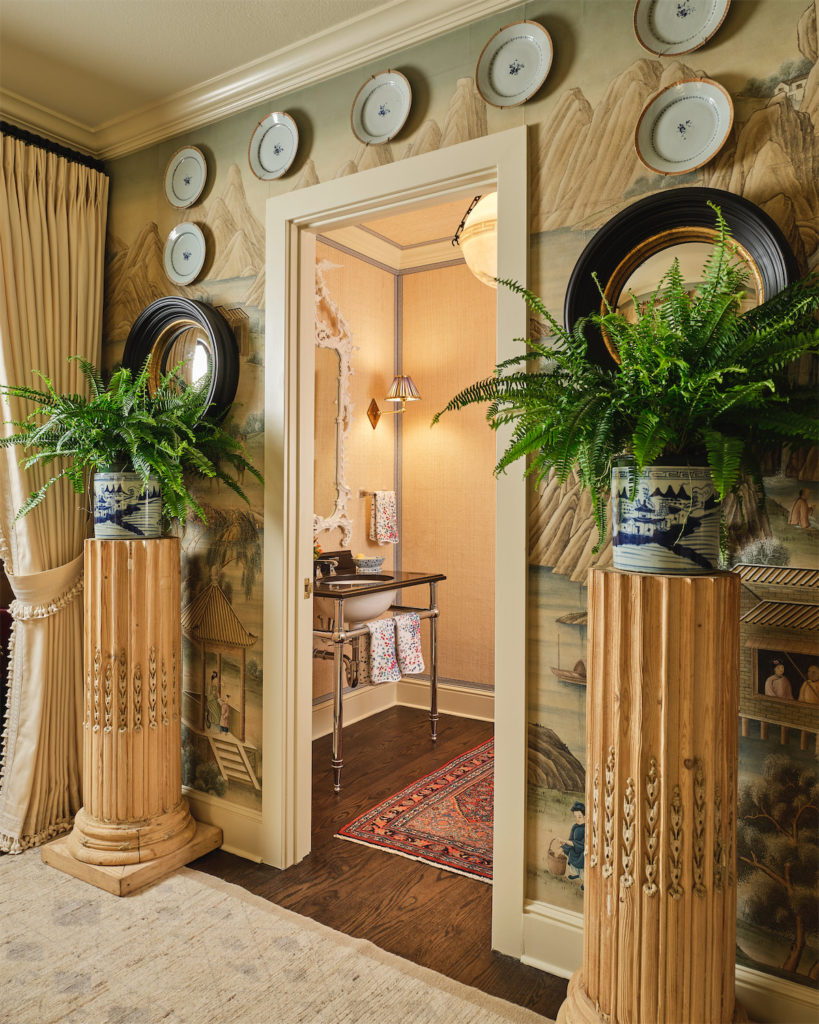 A hallway and powder bath by Caroline Gidiere Design LLC (Photo by Stephen Karlisch)