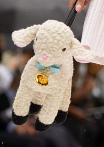 Gigi Hadid playfully nurses a baby bottle on the runway at the Moschino show. (Photo by Randy Brooke/Getty Images for Moschino)