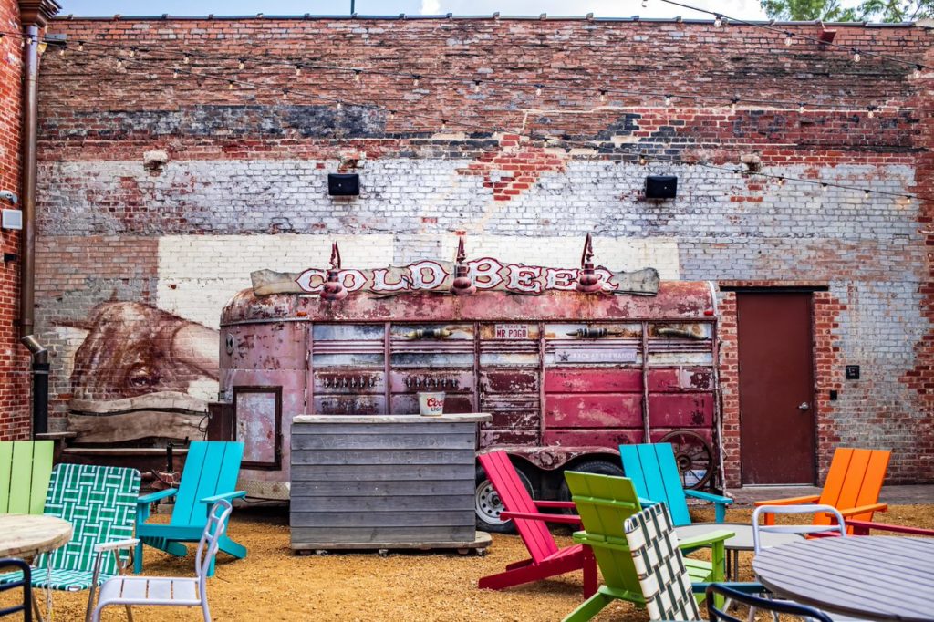A horse trailer modified to serve as a tap wall and satellite bar.