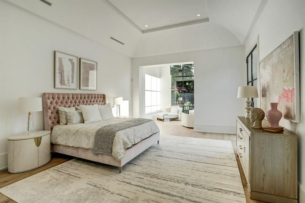 The primary bedroom features a 14-foot vaulted ceiling and separate sitting area. (Photo by TK Images)