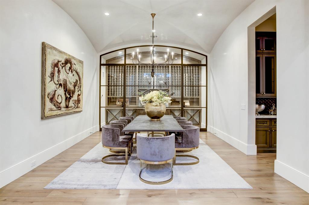 The formal dining room at 5554 Longmont in Tanglewood boasts a temperature controlled wine vault.