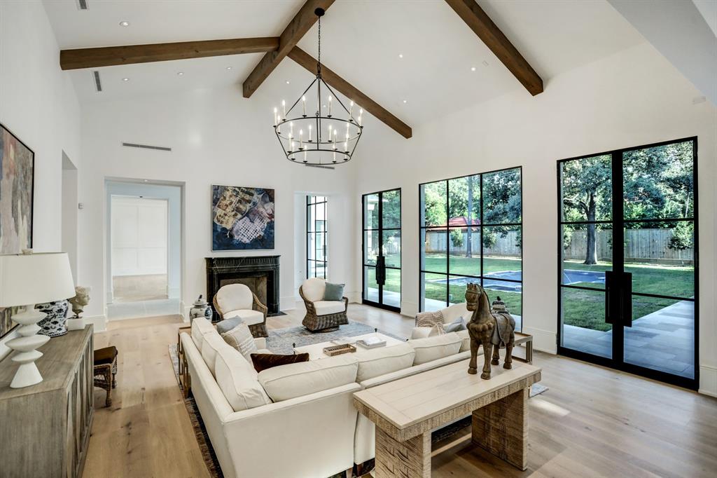 The family room at 3001 Inwood has 18 foot vaulted ceiling with beams. (Photo by TK Images)