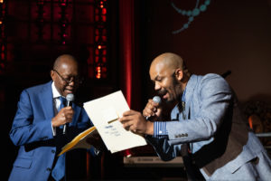 Mayor Sylvester Turner and Outspoken Bean rapping at the Houston Arts Alliance Moulin Rouge themed gala at Majestic Metro theater. (Photo by Daniel Ortiz)
