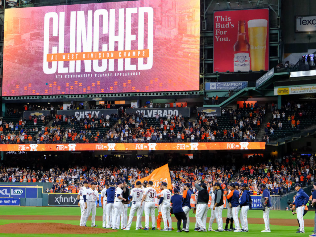 With Clinched frozen on the Minute Maid Park scoreboard, the Houston Astros celebrated another division championship. (Photo by F. Carter Smith)