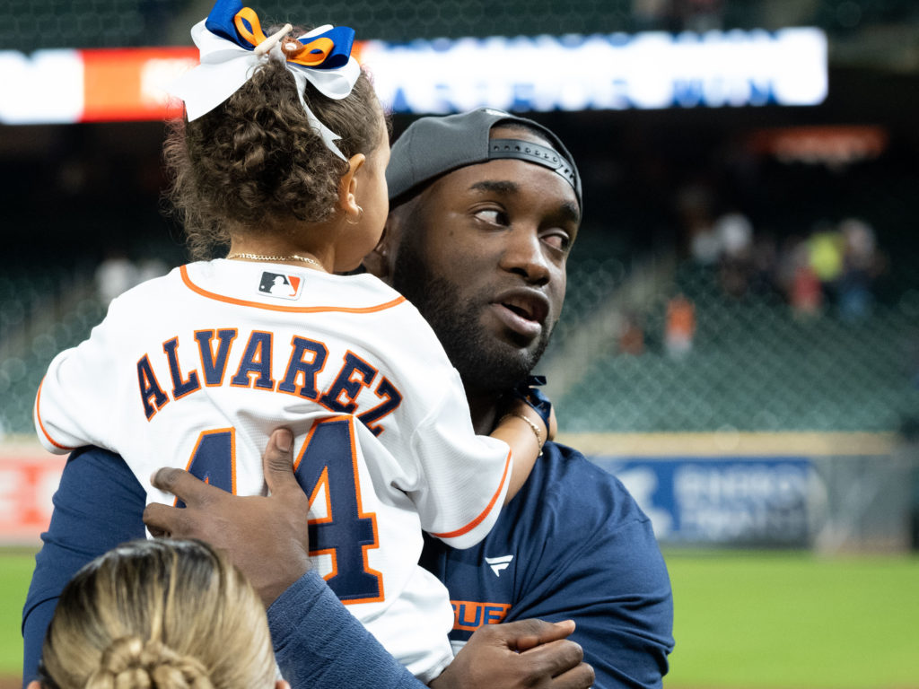 Astros slugger Yordan Alvarez gave his daughter a lift earlier this season. (Photo by F. Carter Smith)