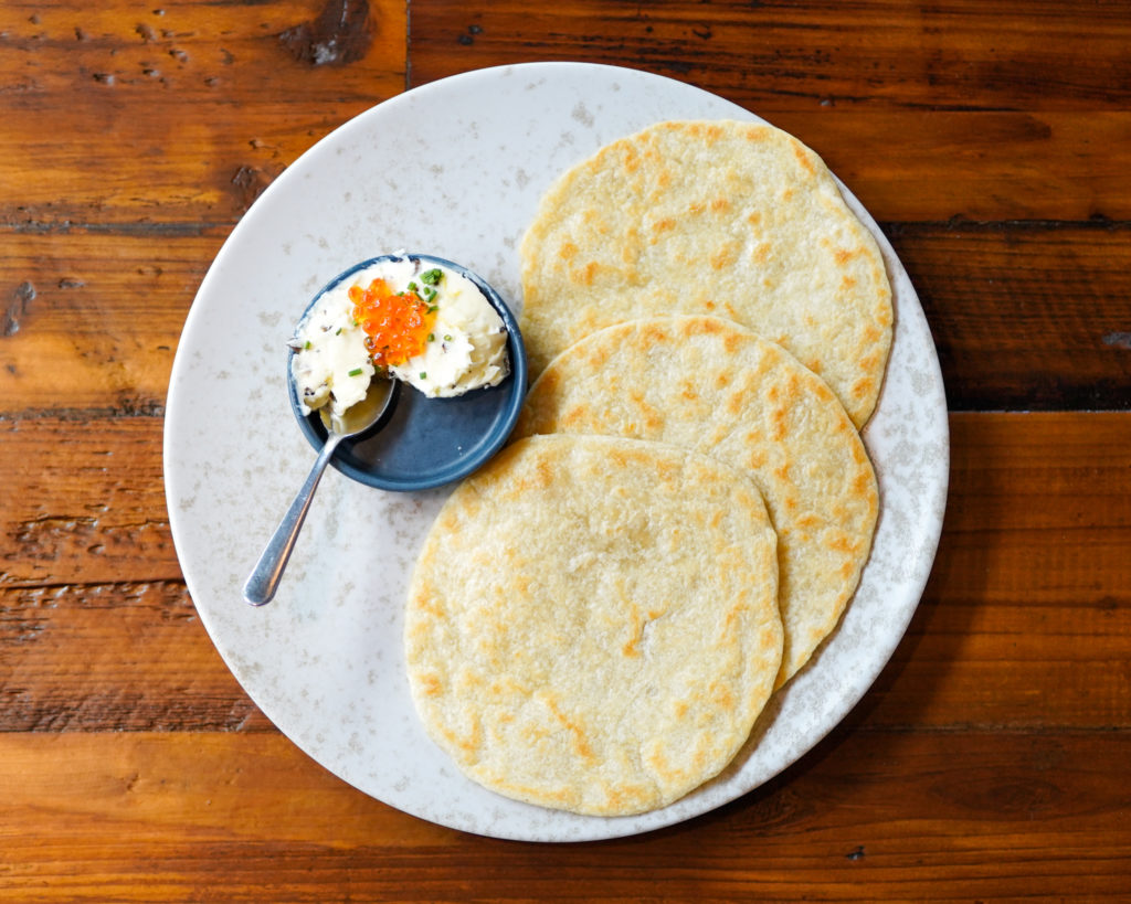 Handmade Flour Tortillas with truffle butter and salmon roe make for a greater starter at Chivos. (Photo by Dylan McEwan)