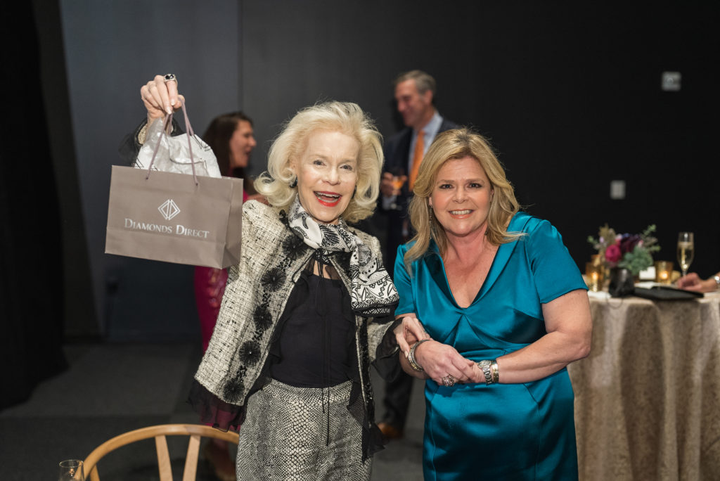 Lynn Wyatt accepts her raffle prize_ photo by Catchlight Group (Photo by CatchLightGroup.com)
