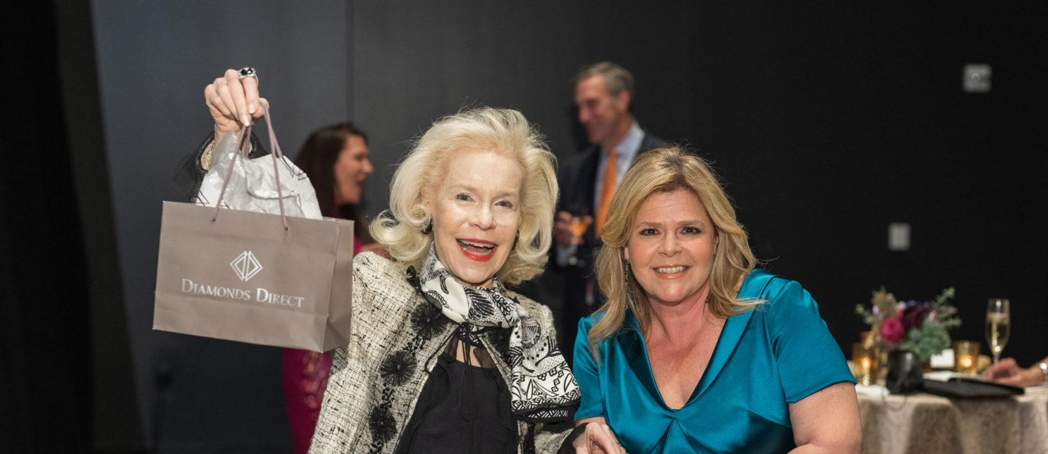 Lynn Wyatt accepts her raffle prize_ photo by Catchlight Group (Photo by CatchLightGroup.com)