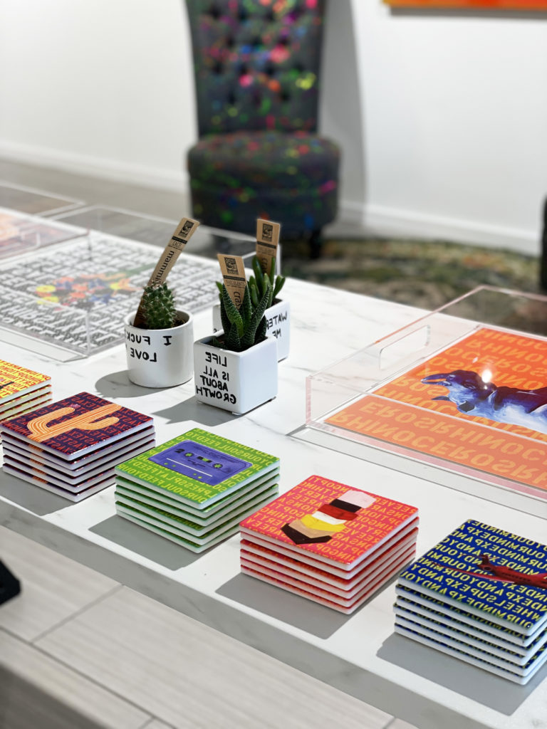 The colorful pop up shop is full of fun whimsical gift items like coasters and trays.