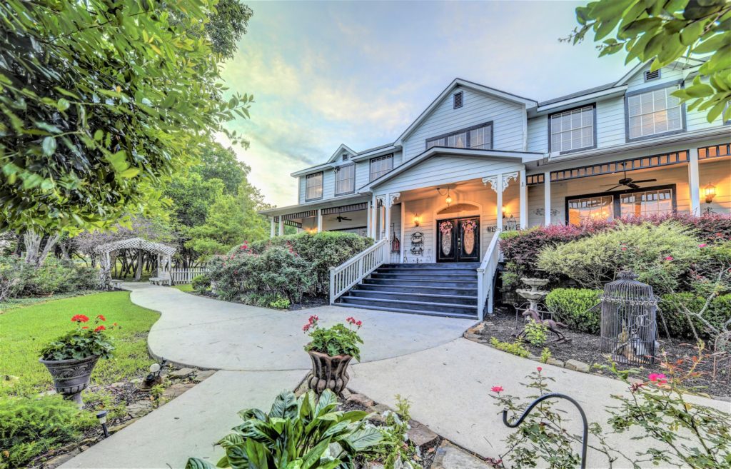 This home is situated on 42 acres of beautiful land, and features 8 bedrooms and 11 baths. 