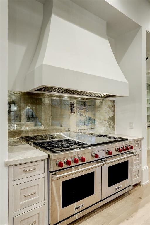 Stainless steel Wolf range with gas burners, large griddle, and dual ovens in the kitchen at 3001 Inwood.  (Photo by TK Images)