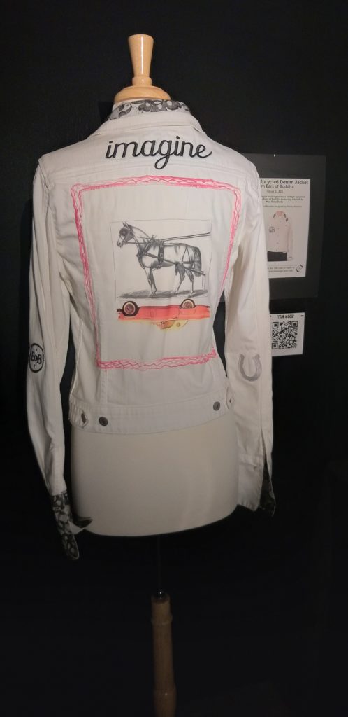 Upcycled denim jacket by Ears of Buddha was among the auction goodies. (Photo by CDA)