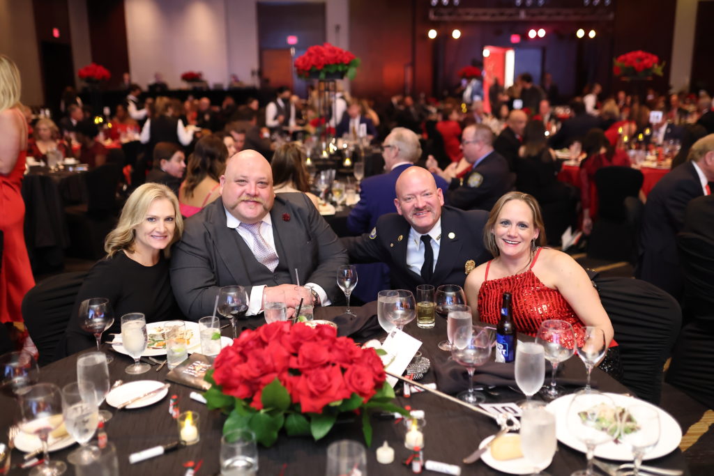 Fire Fighter Tara Grace, Luke Manion, District Fire Chief James & Kristi Campbell at the HPFFA Charitable Foundation 'Red Hot Gala' (Photo by CatchLightGroup.com)