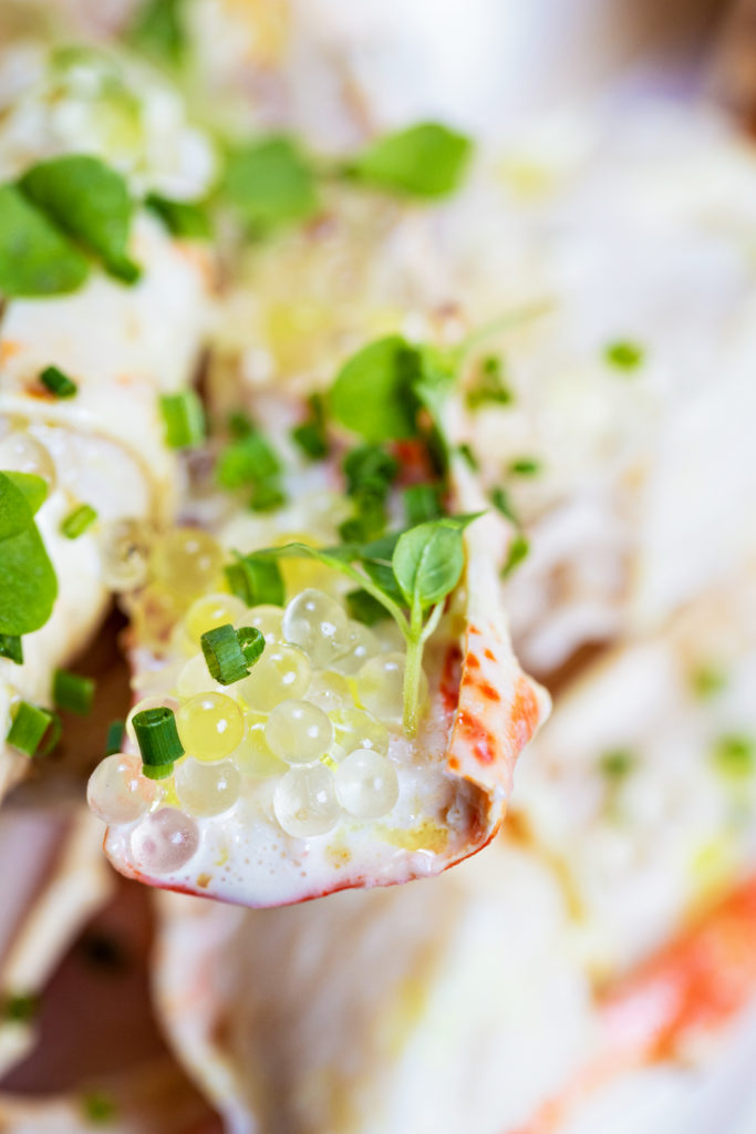 Appetizers at Villa Azur Dallas include King Crab, seared octopus, artichoke hearts, and more.