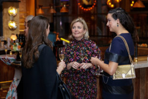 Kit Sawers (center) chatting with guests (Photography by William Neal). (Photo by William Neal)