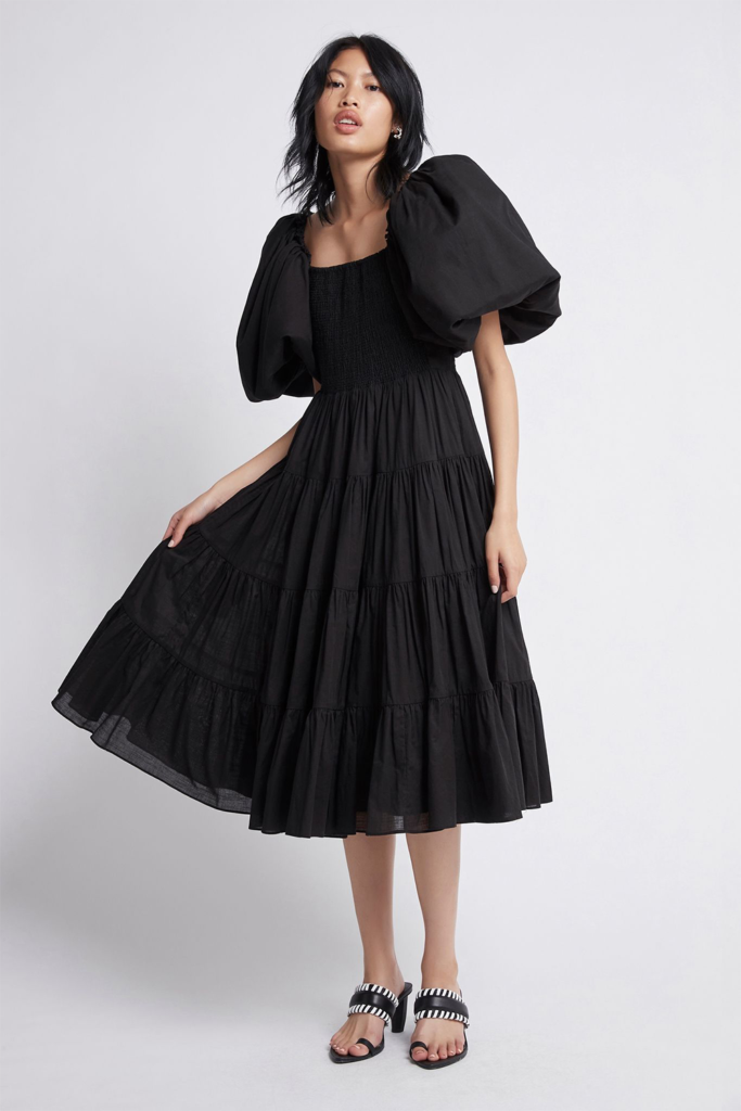 Market AJE black midi dress with fun puffed sleeves is showcasing our favorite holiday trend. ($475)