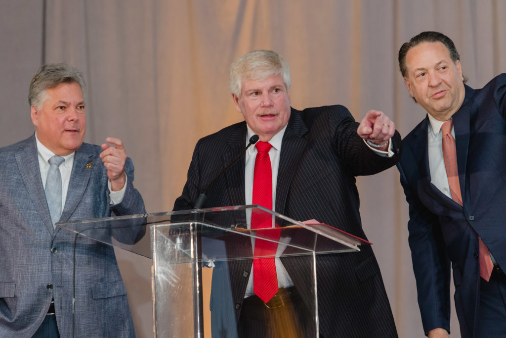 Paddles up with Gala Chairs Neil Leibman, John Eddie Williams, John McIntyre (Photo by CatchlightGroup.com)