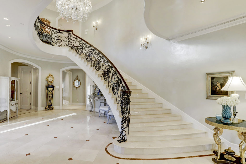 Many a celebrity and dignitary has descended the stairs of the River Oaks Boulevard home once belonging to Baron Ricky di Portanova. (Photo by TK Images)