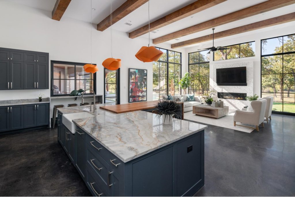 Modern and open great room includes exotic slabs of granite. Photos courtesy of Zach Spross, for Douglas Elliman.