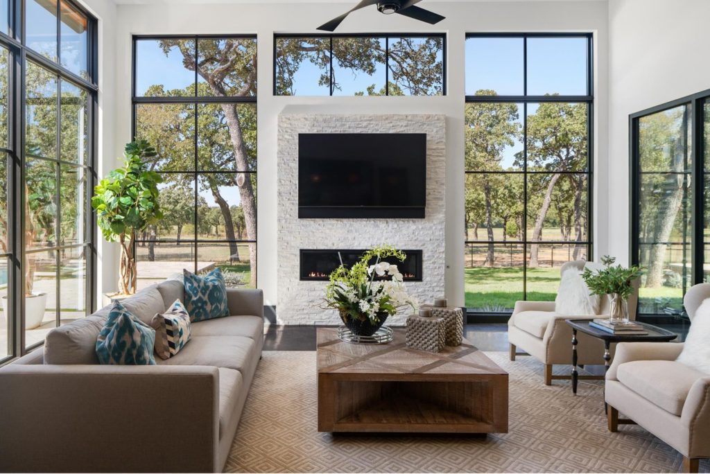 1200 Rockgate Road boasts three-sided walls of glass bringing the outside into the great room. Photos courtesy of Zach Spross, for Douglas Elliman.