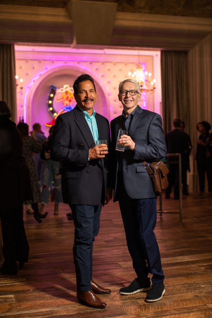 Mercedes S-Class invitees with the glow of the neon bar in the background. Photos by Ashley Gongora.