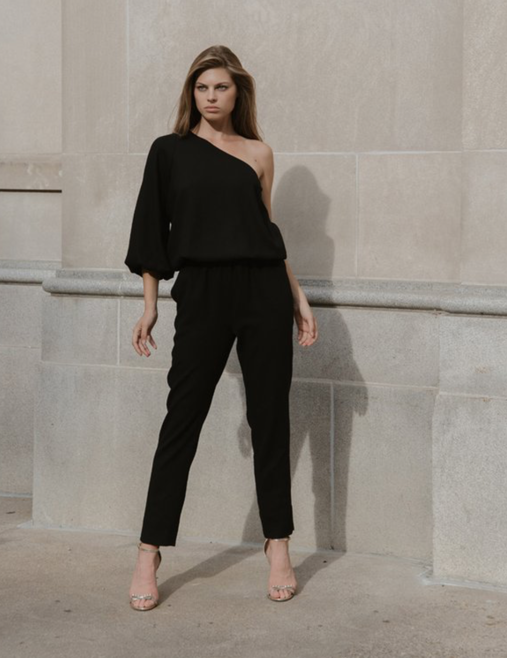 Eve & Max off-shoulder black jumpsuit, $1,250, available at eveandmax.com.