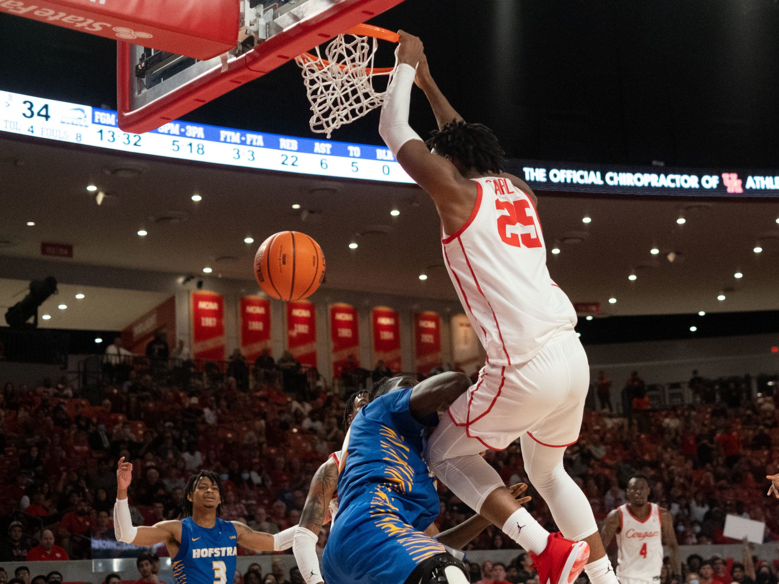 University of Houston Cougars men’s basketball team opened their 2021-2022 season with an overtime victory over the HofstraPride, complete with the presentation of a banner commemorating their trip to last season’s Final Four, Tuesday night at the Fer