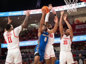 University of Houston Cougars men’s basketball team opened their 2021-2022 season with an overtime victory over the HofstraPride, complete with the presentation of a banner commemorating their trip to last season’s Final Four, Tuesday night at the Fer