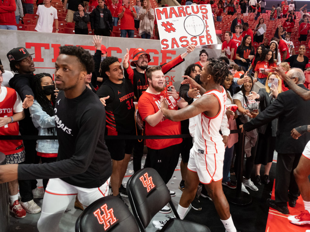 University of Houston basketball players go over to the student section to thank their fans after every home game. Photo by F. Carter Smith) 
