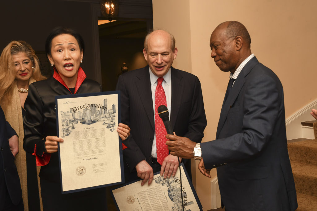 Surprise Mayoral proclamations for both Y. Ping Sun and David Leebron at the Mayor's Hispanic Advisory Board annual holiday reception. (Photo by Vicky Pink)
