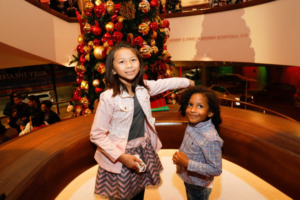 May Luu and August Martinez had the honor of flipping the switch to light the trees at the Alley Theatre 'Deck the Tree' fundraiser (Photo by Priscilla Dickson)
