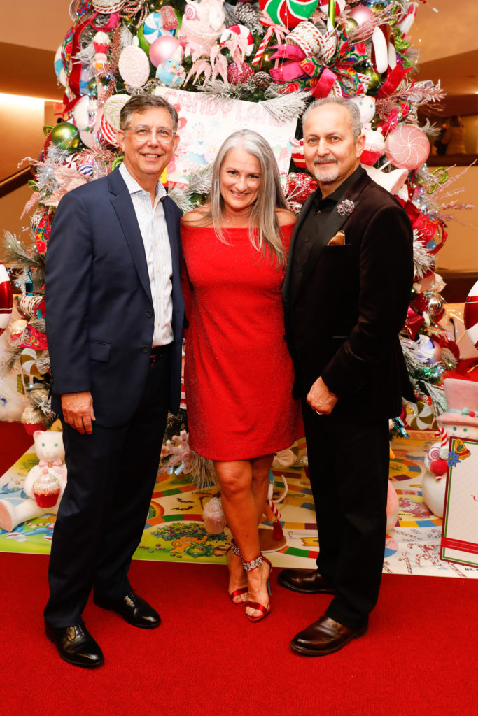 Occidental sponsor Mark Grommesh with tree designer Sherry Boudreaux and her husband, Walter, at the Alley Theatre 'Deck the Trees' evening (Photo by Priscilla Dickson)